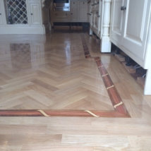 Oak Herringbone with and inlaid border.